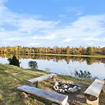 Lomamökit Suvantokoto Riverside Log